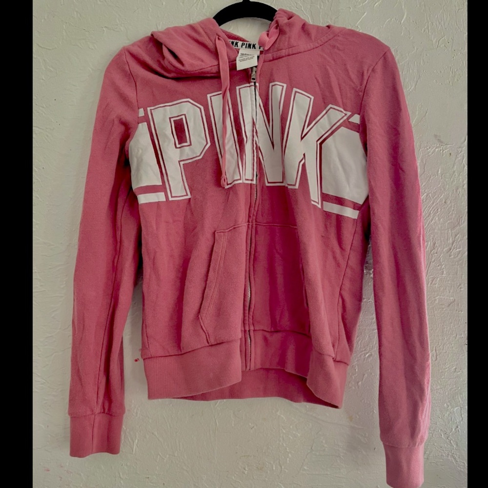 Salmon colored Victoria secret pink jacket.